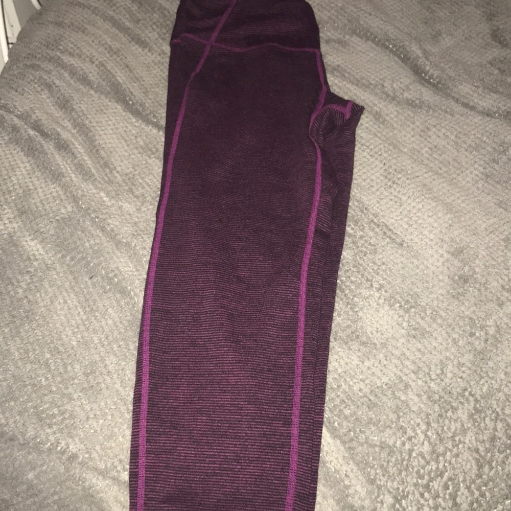 Barely worn black and purple striped yogas